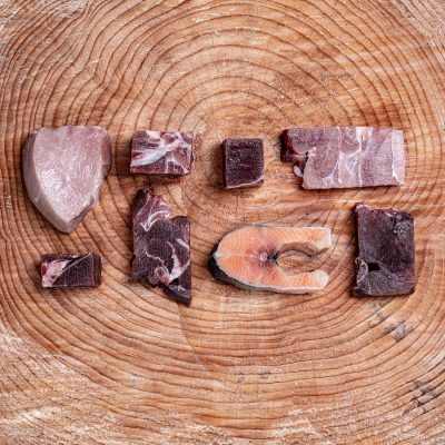 Assortment of Raw Essentials Ingredients Including, Fillets Of Goat, Venison, Wallaby, Salmon, And Veal