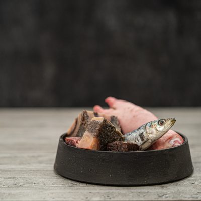 Assortment Of Ingredients Including, Pilchards, Tripe And Trotter In Metal Pet Bowl