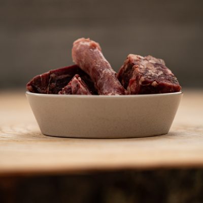 Cubed Chicken Tongue And Heart, And Chicken Neck In Ceramic Pet Bowl